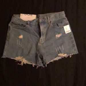 High-rise light blue denim cut-off jeans